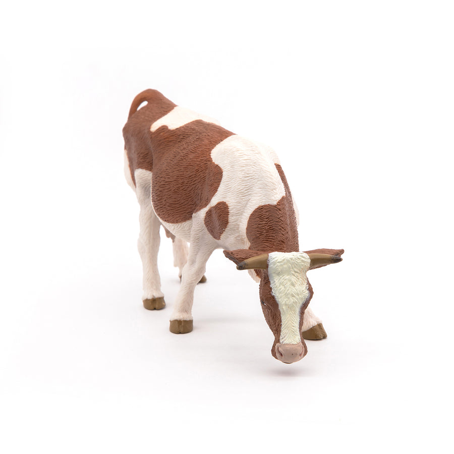 Figurine Vache simmental broutant